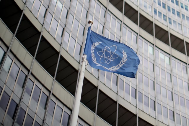 A flag with the logo of the International Atomic Energy Agency (IAEA) flutters in front of their headquarters in Vienna, Austria July 10, 2019.  REUTERS/Lisi Niesner/ File Photo