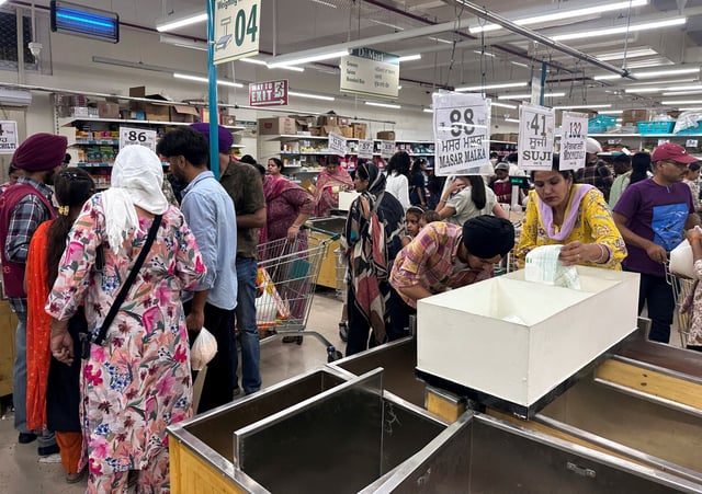 People shop for essential goods at a supermarket in Amritsar, India, May 9, 2025. REUTERS/Francis Mascarenhas/File Photo