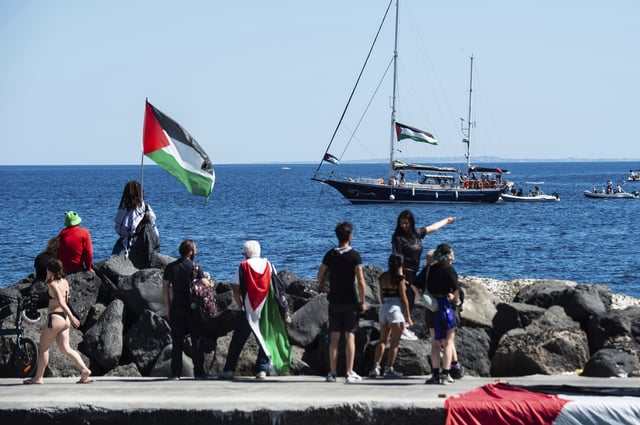 Activists of the Freedom Flotilla Coalition, board the Madleen boat, ahead of setting sail for Gaza, departing from the Sicilian port of Catania, Italy, Sunday, June 1, 2025. (AP Photo/Salvatore Cavalli)