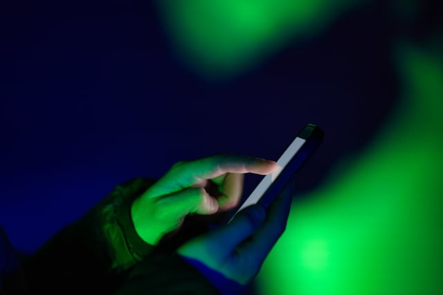 Someone tapping a smartphone. (Image: baranozdemir/Getty Images)