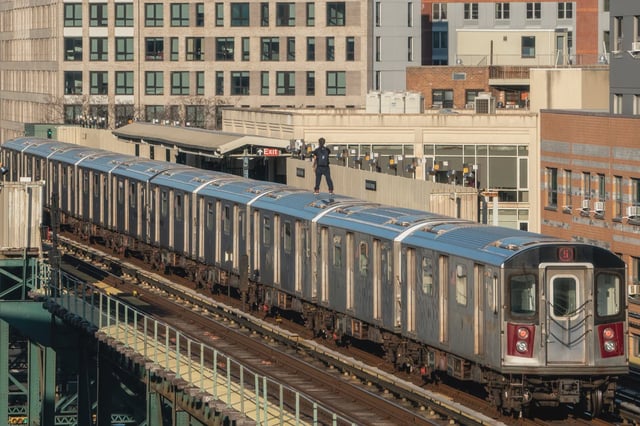 A person is subway surfing on the 5 train on March 16, 2023 in the Bronx borough of New York City.