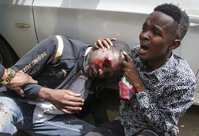A demonstrator is attended to after being injured during a protest over the death in police custody of blogger Albert Ojwang, in Nairobi, Kenya, Thursday, June 12, 2025. (AP Photo/Andrew Kasuku)