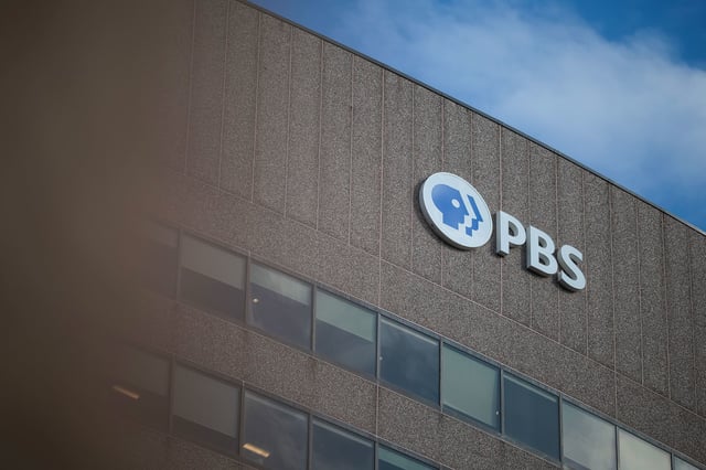 A sign for the Public Broadcasting Service is seen on its building headquarters in Arlington, Virginia, on February 18, 2025.