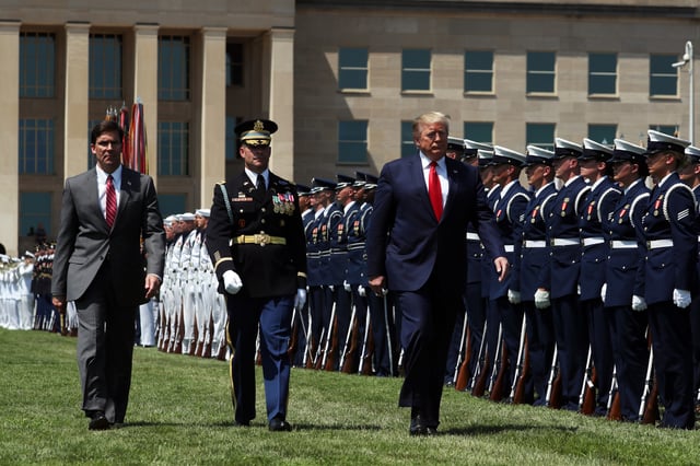 Donald Trump and Secretary of Defense Dr. Mark Esper inspect the troops during a full honors welcome ceremony on the parade grounds at the Pentagon, on July 25, 2019 in Arlington, Virginia.