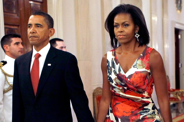 Barack Obama and Michelle Obama hold hands as they arrive for the Medal of Honor ceremony for U.S. Army Sergeant First Class Jared C. Monti, after a ceremony in the East Room of the White House, on September 17, 2009 in Washington, D.C.
