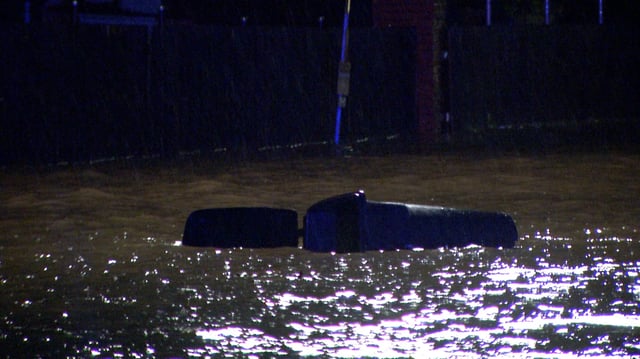 High water is seen at 2 a.m. on Thursday amid heavy rains along Heath Road in San Antonio.