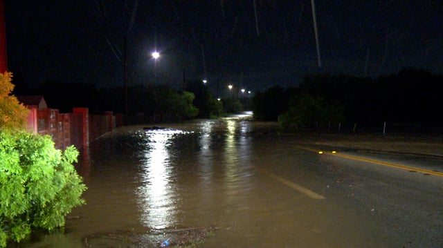 High water is seen at 2 a.m. on Thursday amid heavy rains along Heath Road in San Antonio.