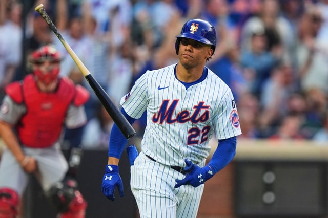 New York Mets&#39; Juan Soto (22) tosses his bat as he runs the bases after hitting a two-run home run during the third inning of a baseball game against the Washington Nationals Wednesday, June 11, 2025, in New York. (AP Photo/Frank Franklin II)