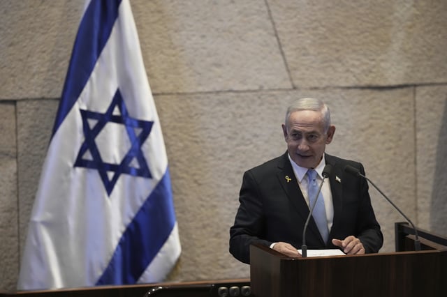 Israel's Prime Minister Benjamin Netanyahu delivers a welcome message during a visit by Argentina's President Javier Milei, in the Knesset, Israel's parliament, in Jerusalem, Wednesday, June 11, 2025. 