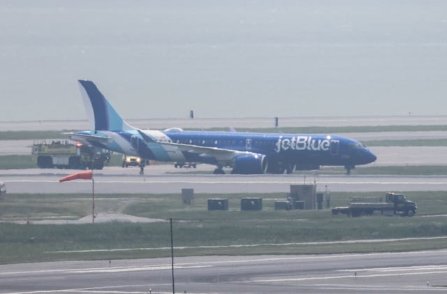 A JetBlue flight that rolled into grass next to the runway at Logan International Airport on June 12, 2025.
