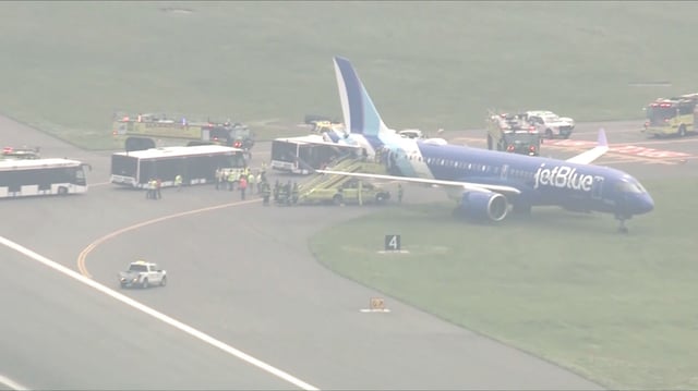 A jetBlue plane is seen off the runway at Boston Logan International Airport on June 12, 2025.