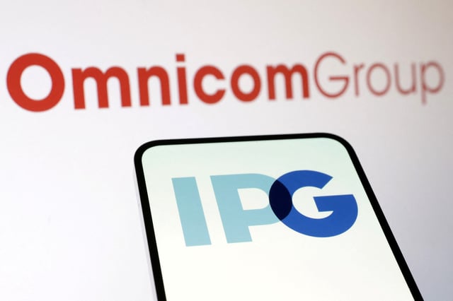 Omnicom Group and Interpublic Group logos are seen in this illustration taken December 9, 2024. REUTERS/Dado Ruvic/Illustration