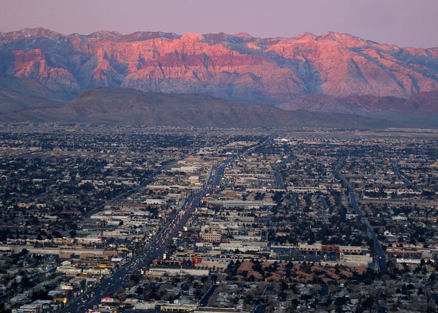 FILE - A view of the suburbs of Las Vegas from atop the Stratosphere tower looking west down Sahara Ave., towards the Spring Mountains, Feb. 9, 2005. (AP Photo/Joe Cavaretta, File)