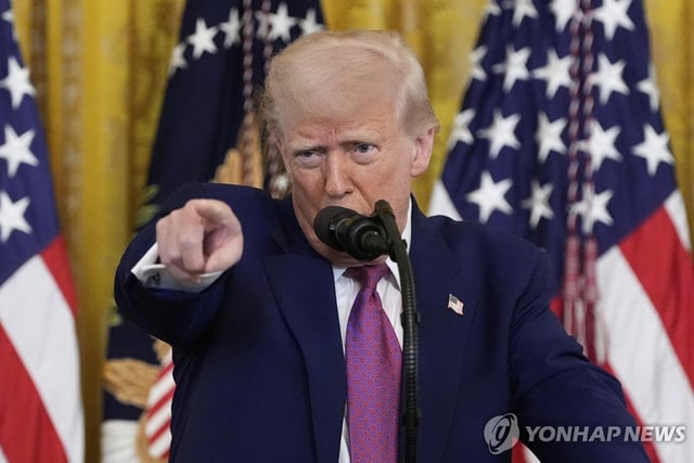 U.S. President Donald Trump takes a question from a reporter during an event signing a bill blocking California's rule banning the sale of new gas-powered cars by 2035, at the White House in Washington on June 12, 2025 in this photo released by the Associated Press. (Yonhap)