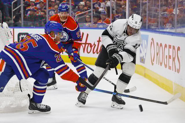 May 1, 2025; Edmonton, Alberta, CAN; Los Angeles Kings forward Anze Kopitar (11) and Edmonton Oilers defensemen Darnell Nurse (25) battle along the boards for a loose puck during the second period in game six of the first round of the 2025 Stanley Cup Playoffs at Rogers Place. Mandatory Credit: Perry Nelson-Imagn Images/File Photo