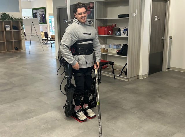 Former Humboldt Bronco Ryan Straschnitzki walks using a new exoskeleton in Calgary on Thursday June 12, 2025. 
THE CANADIAN PRESS/Bill Graveland