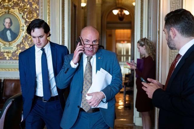 Sen. Mike Lee walks through the Senate Reception Room in the U.S. Capitol on December 17, 2024.