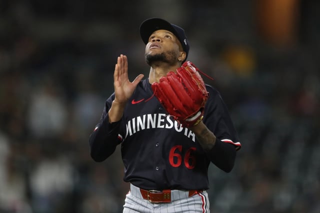 Minnesota Twins pitcher Jorge Alcala gestures towards the sky after the final out of the eighth inning of a baseball game against the Athletics, Tuesday, June 3, 2025, in West Sacramento, Calif. (AP Photo/Scott Marshall)