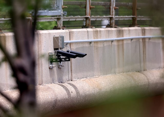 Vehicles drive past license plate reader cameras attached to the overpass at Western Avenue and the Eisenhower Expressway in Chicago on June 4, 2024. (Antonio Perez/Chicago Tribune)