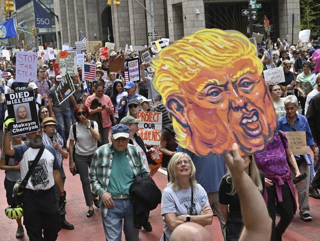 Thousands of people fill midtown in Manhattan to protest the Trump administration&#39;s attacks on the government, climate, tariffs, immigration and education among many other issues. The organization 50501 addressed the issues of the attacks on immigration by the Trump White House.