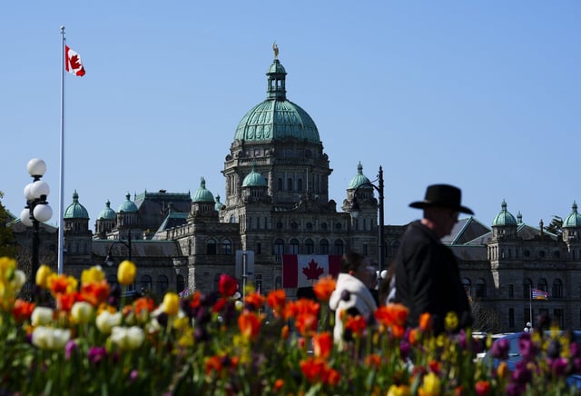 The B.C. legislature is pictured as people walk in downtown Victoria, B.C., on Wednesday, April 23, 2025. THE CANADIAN PRESS/Sean Kilpatrick