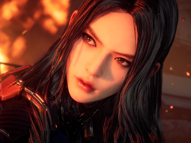Tachy, with her face lit by fire in the background