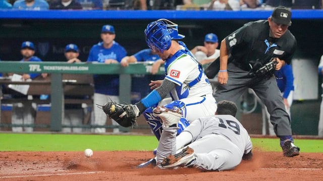 Kansas City Royals catcher Freddy Fermin (34) can’t make the tag as New York Yankees second baseman Pablo Reyes (19) scores in the eighth inning at Kauffman Stadium on June 12, 2025.
