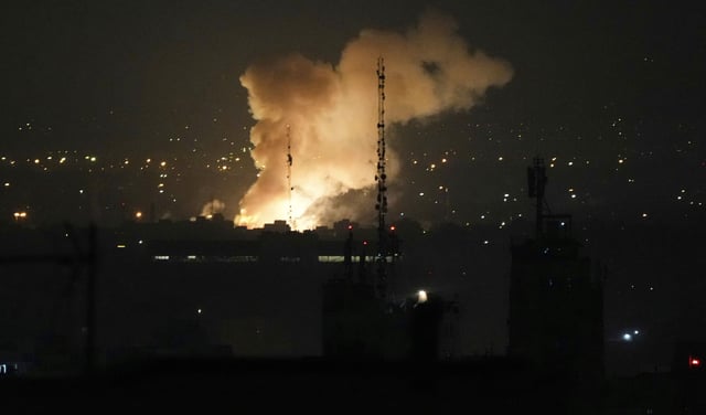 Smoke rises up after an explosion in Tehran, Iran, Friday, June 13, 2025.