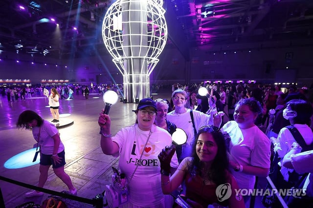 Fans from France enjoy the 2025 BTS Festa at the KINTEX convention center in Goyang, just northwest of Seoul, on June 13, 2025. (Yonhap)