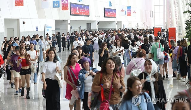 Fans of global K-pop sensation BTS line up to enter the 2025 BTS Festa at the KINTEX convention center in Goyang, just northwest of Seoul, on June 13, 2025. (Yonhap)