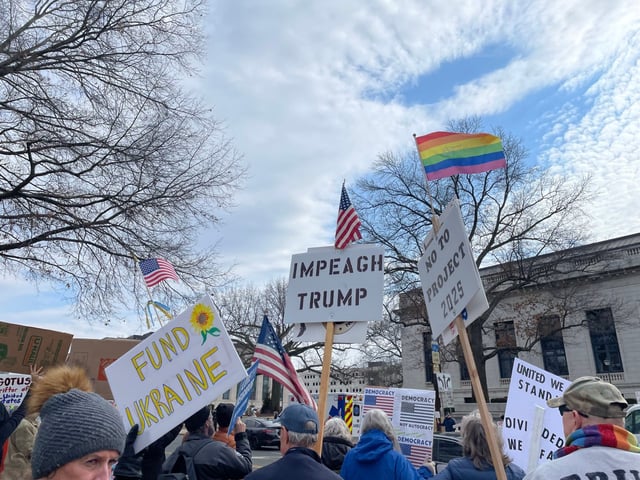 Protesters against President Donald Trump hold signs at a “No Kings Day” rally at the state Capitol in Hartford on March 4. (Christopher Keating/Hartford Courant)