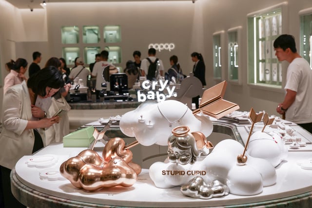 People visit a newly opened Popop store, the Chinese toy maker Pop Mart's premium jewellery brand, in Shanghai, China June 13, 2025. REUTERS/Go Nakamura