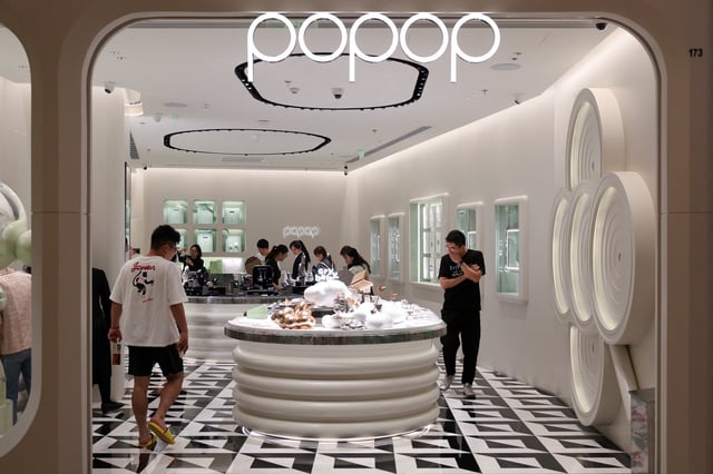 People visit a newly opened Popop store, the Chinese toy maker Pop Mart's premium jewellery brand, in Shanghai, China June 13, 2025. REUTERS/Go Nakamura