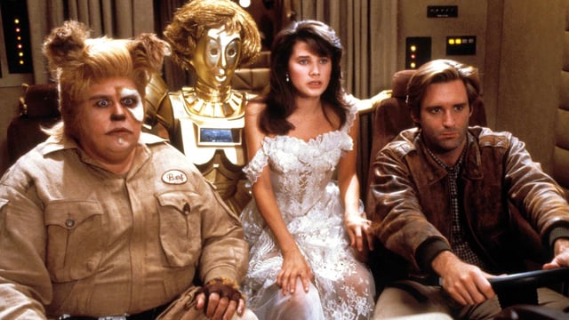 John Candy as Barf, Joan River as Dot Matrix, Daphne Zuniga as Princess Vespa, and Bill Pullman as Lone Starr in Spaceballs