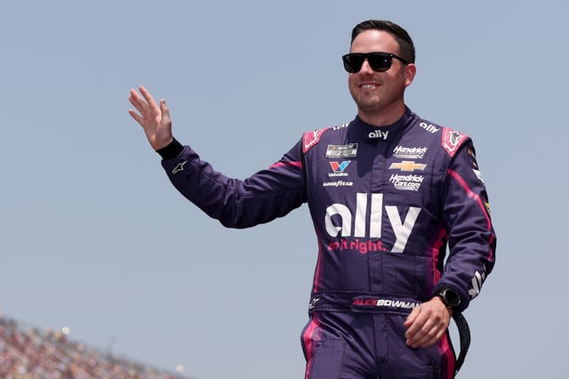 Alex Bowman, driver of the #48 Ally Chevrolet, waves to fans as he walks onstage during driver intros prior to the NASCAR Cup Series FireKeepers Casino 400 at Michigan International Speedway on June 08, 2025 in Brooklyn, Michigan.