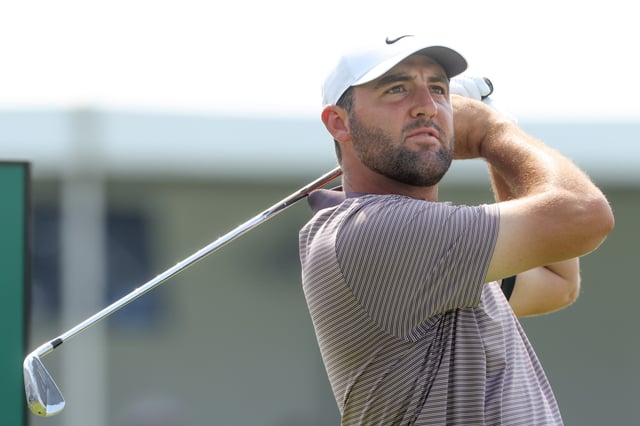 Jun 12, 2025; Oakmont, Pennsylvania, USA; Scottie Scheffler plays his shot from the tenth tee during the first round of the U.S. Open golf tournament. Mandatory Credit: Charles LeClaire-Imagn Images