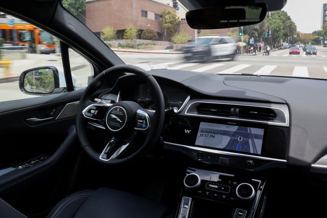 A self-driving Waymo car drives through Los Angeles, California, U.S., May 12, 2025. REUTERS/Kylie Cooper/ File Photo
