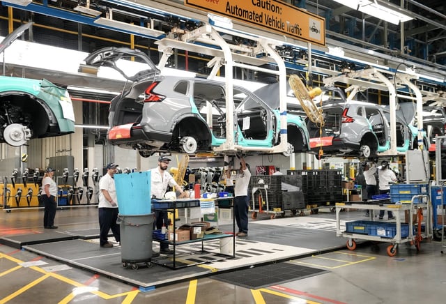 Honda employees work along the vehicle assembly line in Alliston, Ont., on Thursday, April 25, 2024. THE CANADIAN PRESS/Nathan Denette