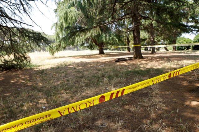 A security cordon separates the crime scene from public access inside Villa Pamphili park where an American woman and her newborn child were found dead on June 7, in Rome, Italy  June 13, 2025. REUTERS/Remo Casilli