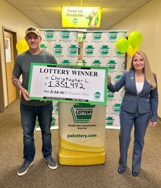 Winner Christopher Lehman with Pennsylvania Lottery Western Regional Sales Manager Victoria Holman on June 10, 2025, in Pittsburgh.