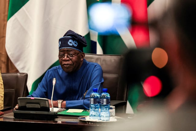 FILE PHOTO: Nigerian President Bola Tinubu looks on as he meets with South African President Cyril Ramaphosa in Cape Town, South Africa, December 3, 2024.REUTERS/Esa Alexander/File Photo