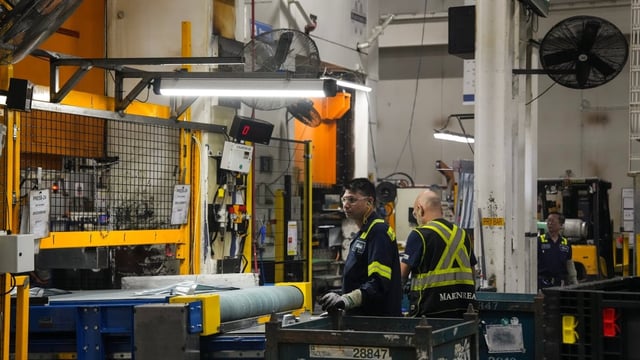 Employees work on the production line at the Martinrea auto parts manufacturing plant in Woodbridge, Ont., on Feb. 3, 2025. Statistics Canada says manufacturing sales fell 2.8 per cent in April, the largest monthly drop since October 2023, as the tariff dispute with the United States hit the industry.