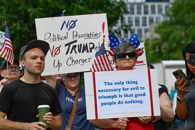 Supporters of Kilmar Abrego Garcia protest before his arraignment at Fred Thompson Federal Courthouse in Nashville, Tenn., on June 13, 2025.