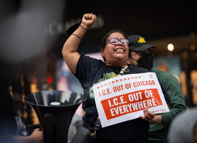 A protester chants while marching down Michigan Avenue in Chicago during a protest against ICE on June 12, 2025. (Audrey Richardson/Chicago Tribune)