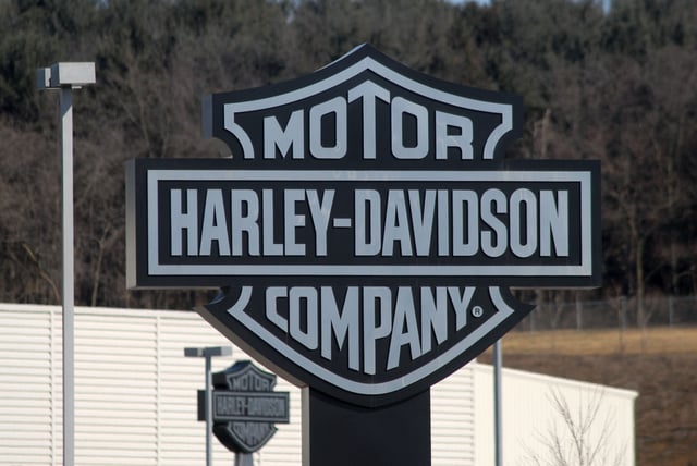 The Harley Davidson sign is displayed on the front lawn as members of International Association of Machinists and Aerospace Workers Local 175 walk the picket line outside the Harley Davidson plant in York, Pennsylvania.