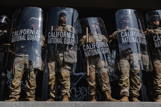 National Guardsmen stand outside the Edward Roybal Federal Building on June 9, 2025 in Downtown Los Angeles.