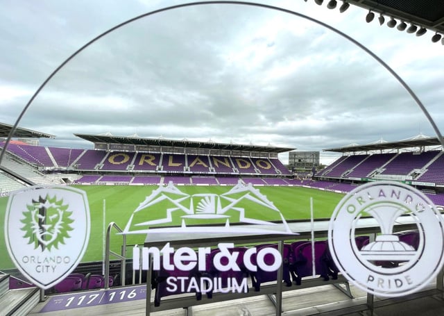 The stadium is pictured through a glass plaque during a press conference to announce the naming rights of Orlando’s soccer stadium to “Inter&amp;Co Stadium” at the facility on Thursday, January 18, 2024. (Stephen M. Dowell/Orlando Sentinel)