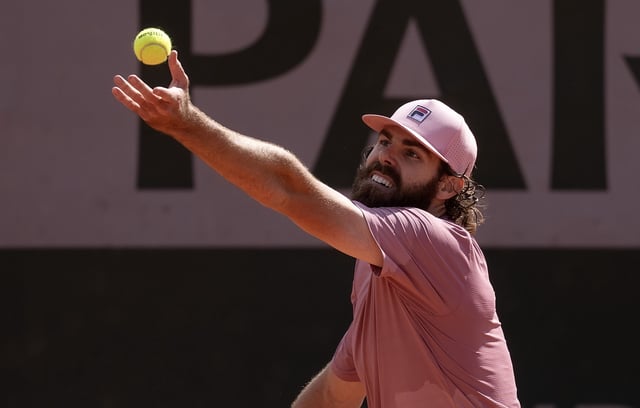 May 25, 2025; Paris, FR; Reilly Opelka of the United States tosses the ball to serve during his match against Rinky Hijikata of Australia on day one at Roland Garros Stadium. Mandatory Credit: Susan Mullane-Imagn Images/File Photo
