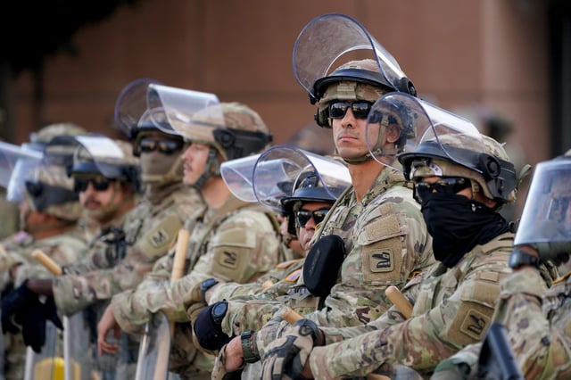 National Guard members stand guard outside the Edward R. Roybal Federal Building during a protest against federal immigration sweeps, in Los Angeles, California, U.S., June 12, 2025. Missouri's governor activated the National Guard June 12 ahead of planned protests.