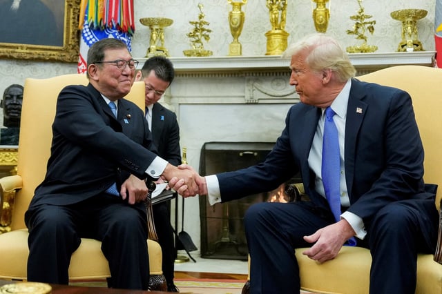 U.S. President Donald Trump shakes hands with Japan's Prime Minister Shigeru Ishiba at the White House in Washington, U.S., February 7, 2025. REUTERS/Kent Nishimura/File Photo